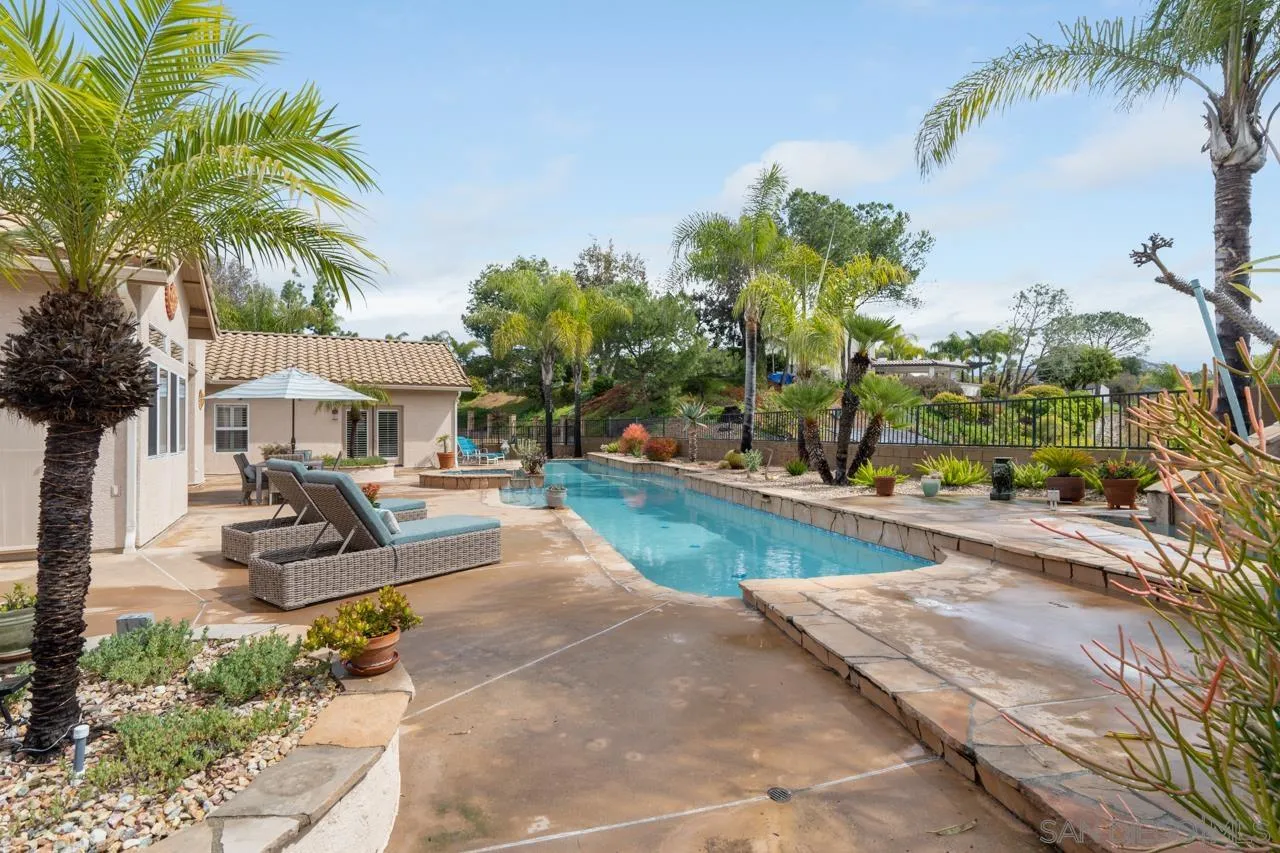 12245 Malabar Drive Poway, CA 92064 - Photo 36 of 43 a front view of a house with swimming pool and sitting area