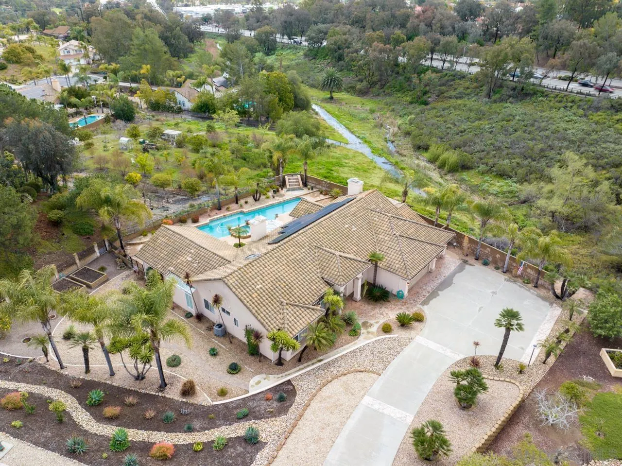 12245 Malabar Drive Poway, CA 92064 - Photo 4 of 43 a view of a house with a yard and potted plants