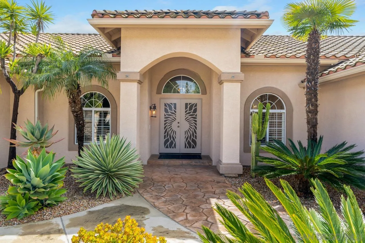 12245 Malabar Drive Poway, CA 92064 - Photo 9 of 43 a front view of a house with garden
