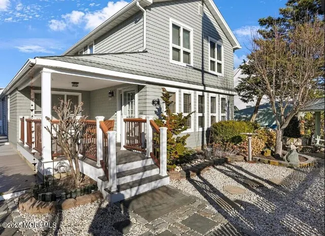 a view of a house with a tree