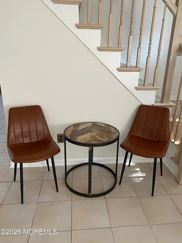 a view of a chairs and table in a room