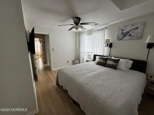 a bedroom with a bed and a mirror