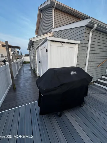a view of balcony with wooden floor