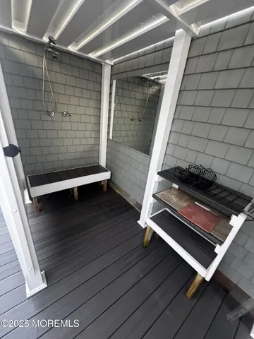 a view of room with wooden floor