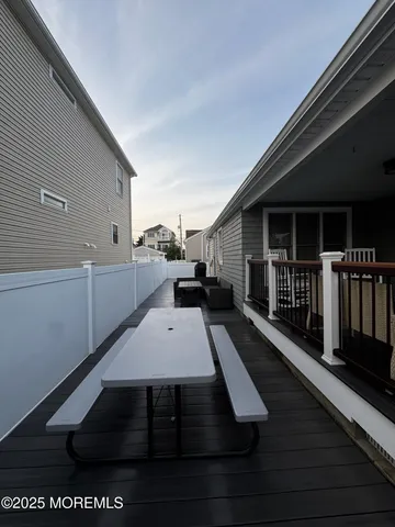 a view of a balcony with wooden floor