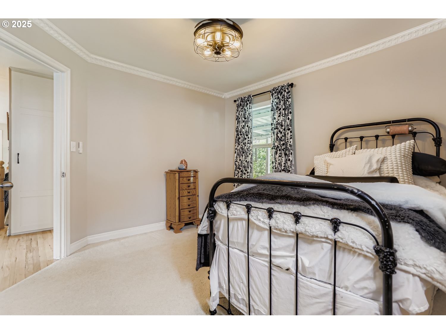 4711 Southeast Roethe Road Milwaukie, OR 97267 - Photo 15 of 30 a bedroom with a bed and a window