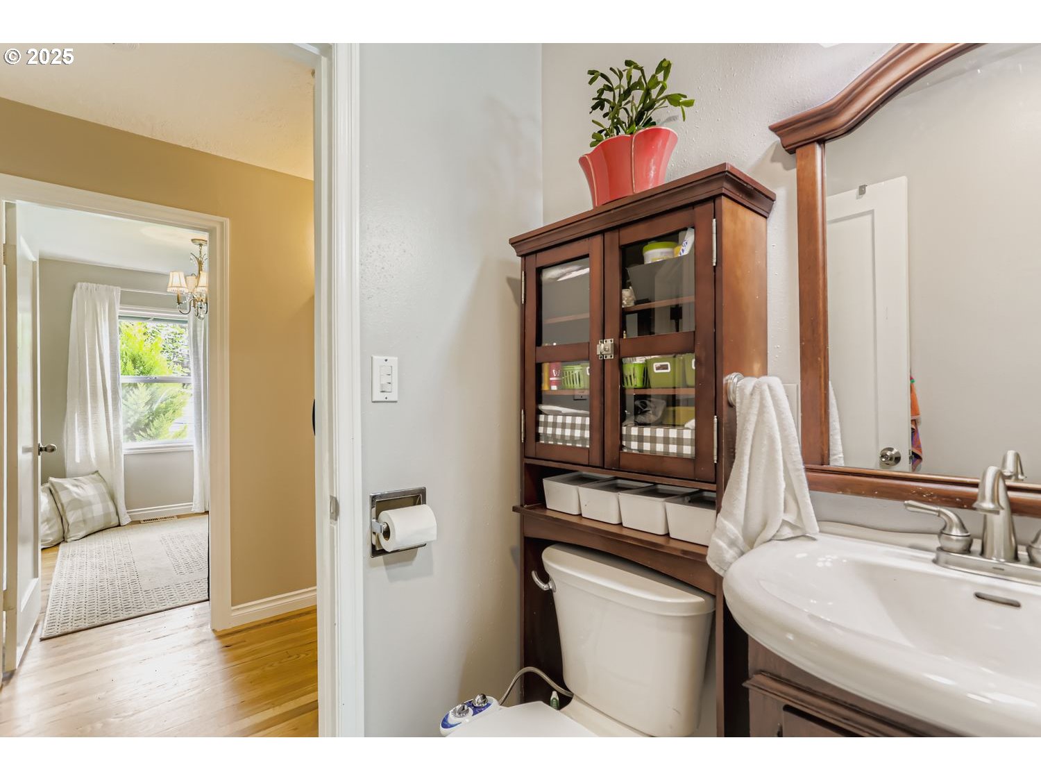 4711 Southeast Roethe Road Milwaukie, OR 97267 - Photo 17 of 30 a bathroom with a sink a mirror and a window