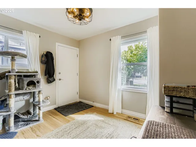a view of livingroom with furniture wooden floor and windows