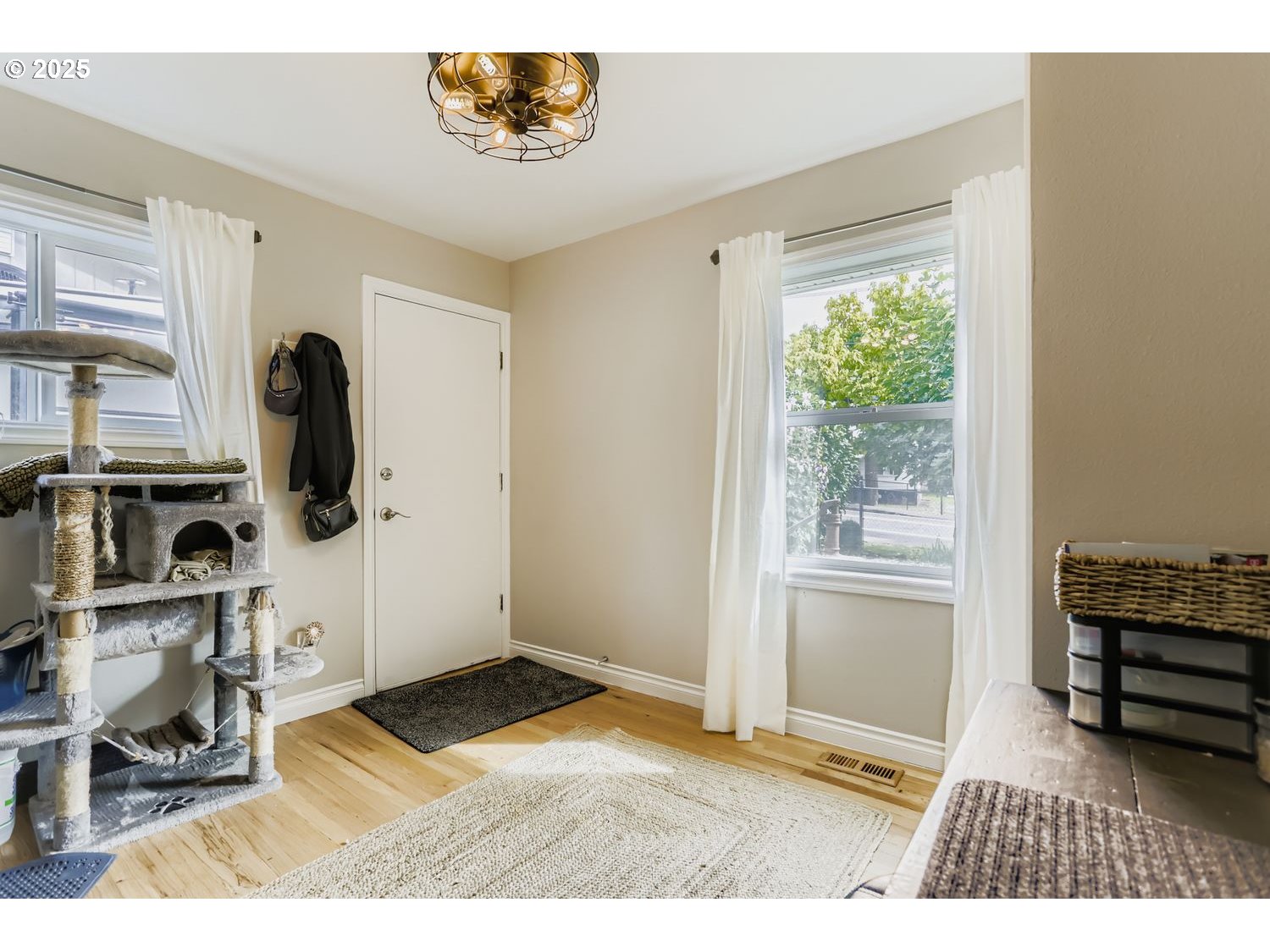 4711 Southeast Roethe Road Milwaukie, OR 97267 - Photo 18 of 30 a view of livingroom with furniture wooden floor and windows