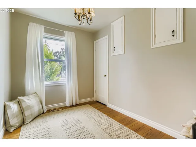 a view of room with window and hallway