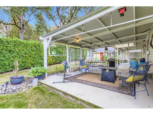 a view of a chairs and table in a patio