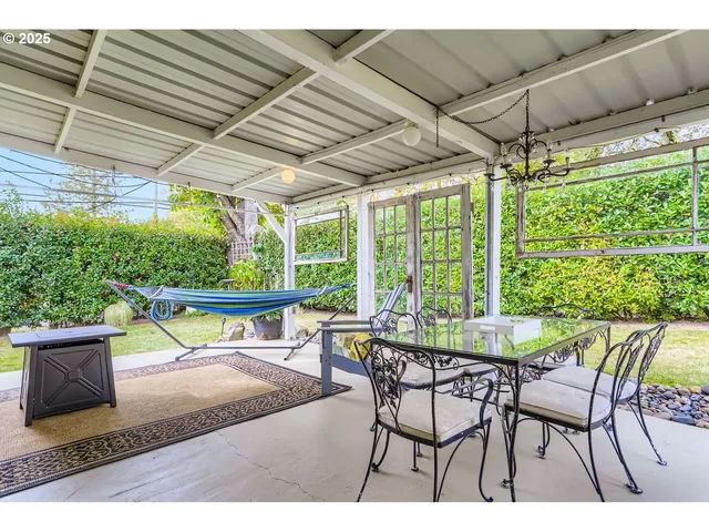 a view of a chairs and table in the patio