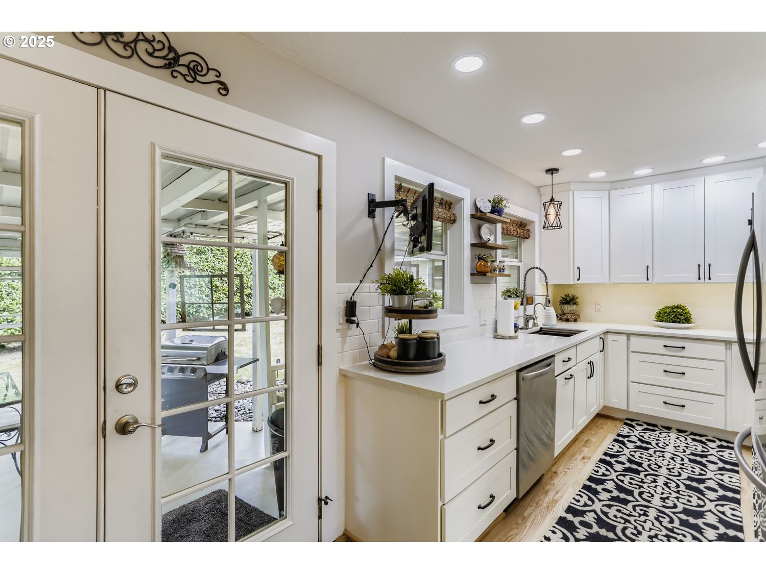 4711 Southeast Roethe Road Milwaukie, OR 97267 - Photo 9 of 30 a kitchen with white cabinets and white appliances