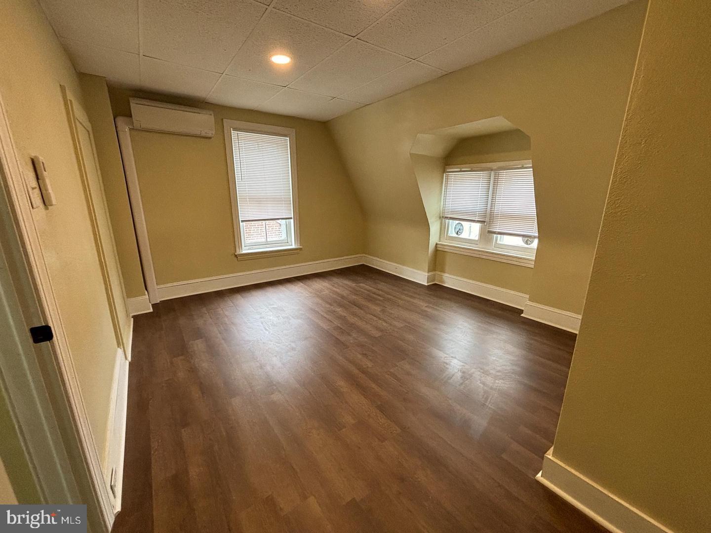 130 East 4th Street, Unit 2 Pottstown, PA 19464 - Photo 5 of 16 a view of an empty room with wooden floor and a window
