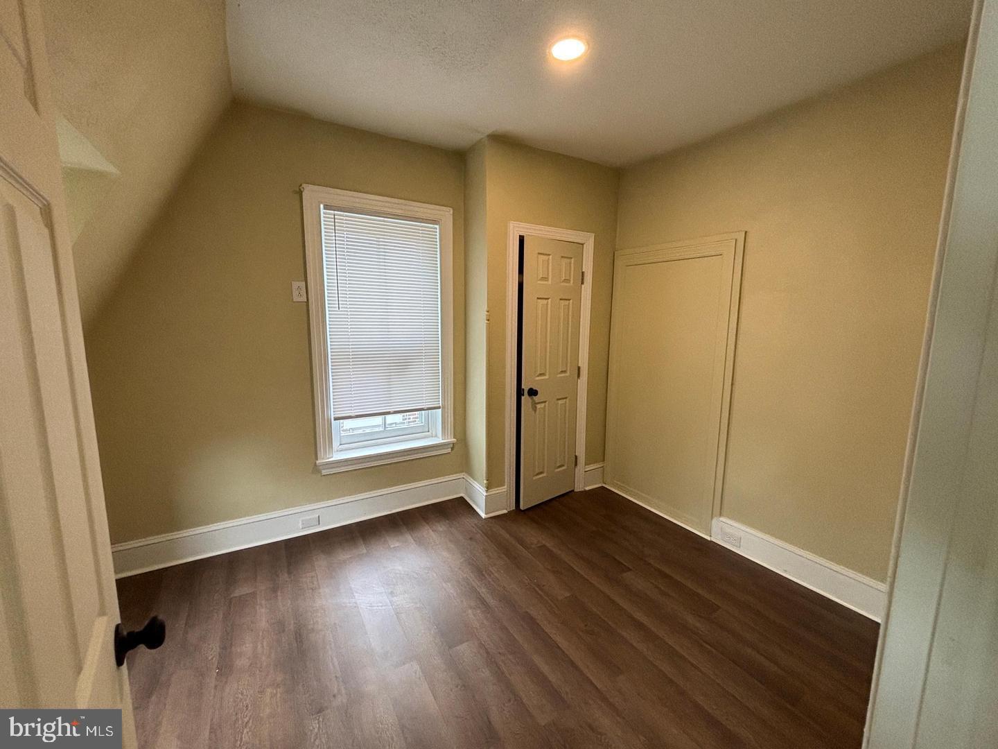 130 East 4th Street, Unit 2 Pottstown, PA 19464 - Photo 6 of 16 an empty room with wooden floor and windows