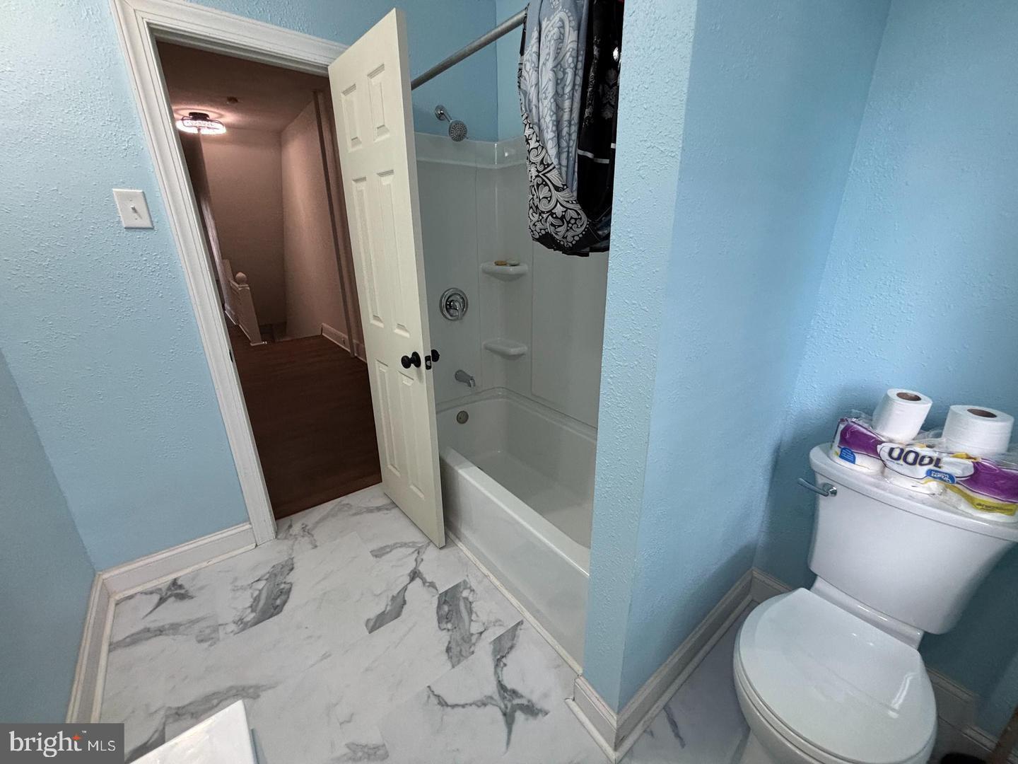 130 East 4th Street, Unit 2 Pottstown, PA 19464 - Photo 8 of 16 a bathroom with a toilet and a shower