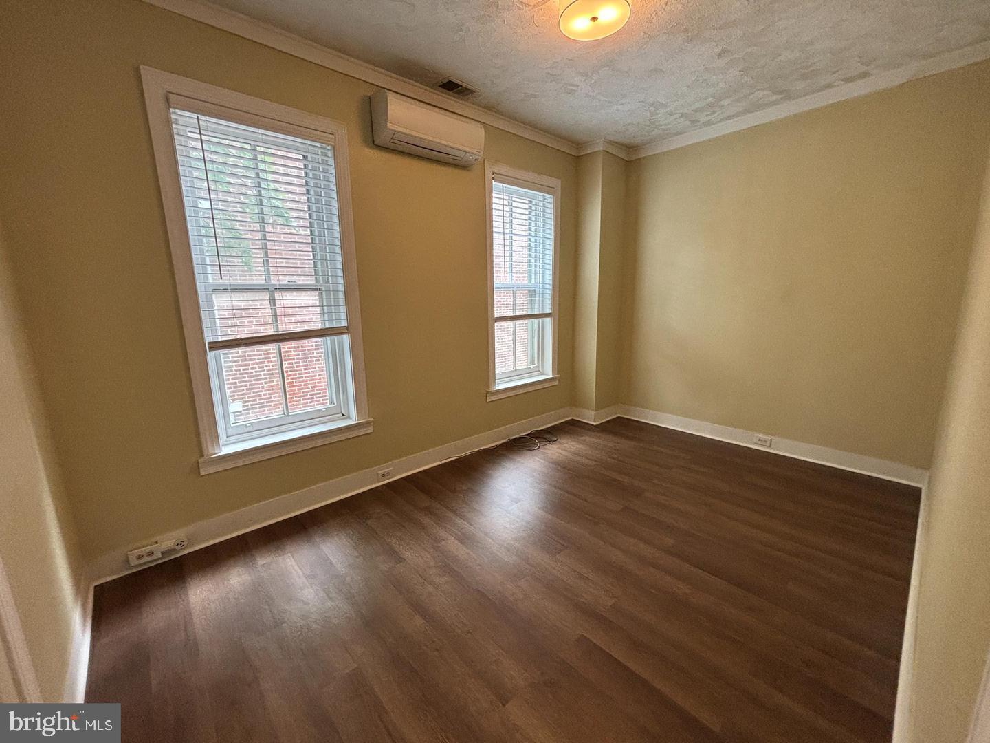130 East 4th Street, Unit 2 Pottstown, PA 19464 - Photo 10 of 16 a view of an empty room with wooden floor and a window