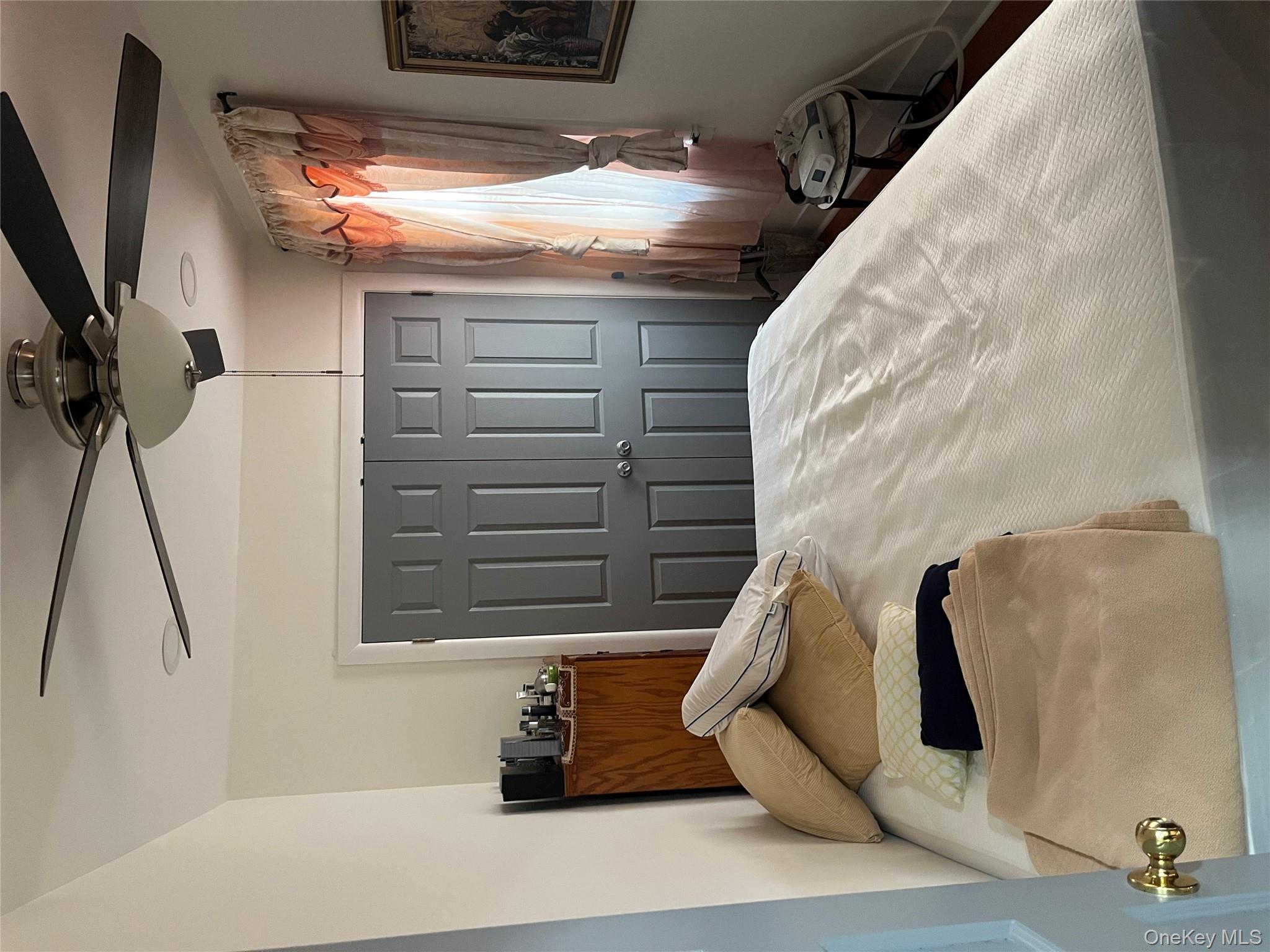 149 West Kingsbridge Road Mount Vernon, NY 10550 - Photo 12 of 25 Bedroom with a closet and a ceiling fan