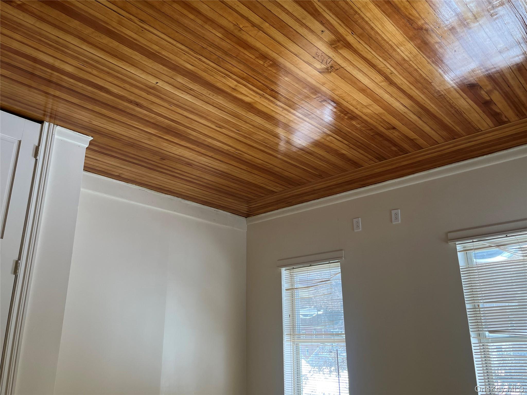 149 West Kingsbridge Road Mount Vernon, NY 10550 - Photo 16 of 25 Unfurnished room featuring wood-type flooring and baseboards