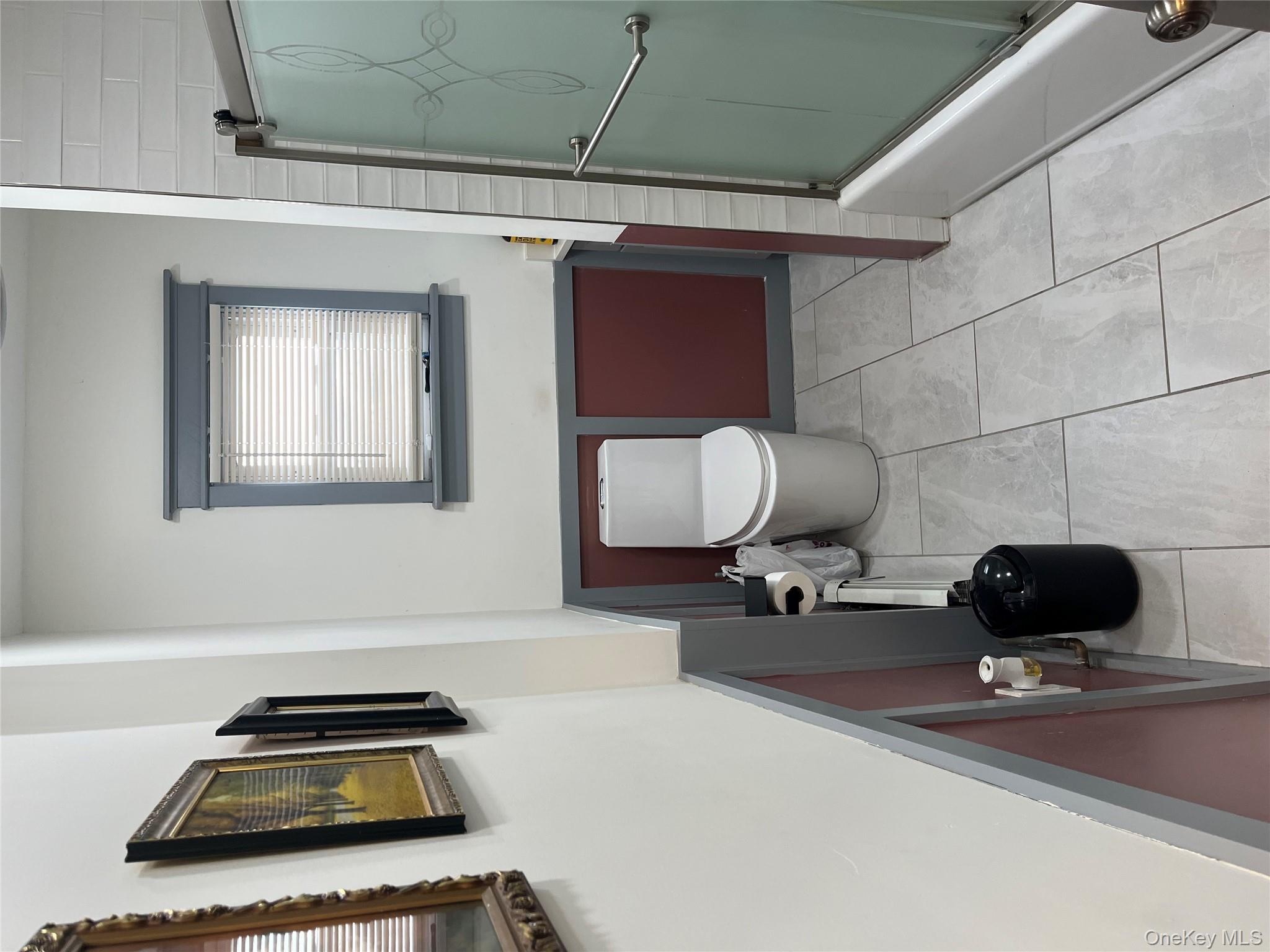 149 West Kingsbridge Road Mount Vernon, NY 10550 - Photo 8 of 25 Full bathroom featuring enclosed tub / shower combo and light tile patterned floors