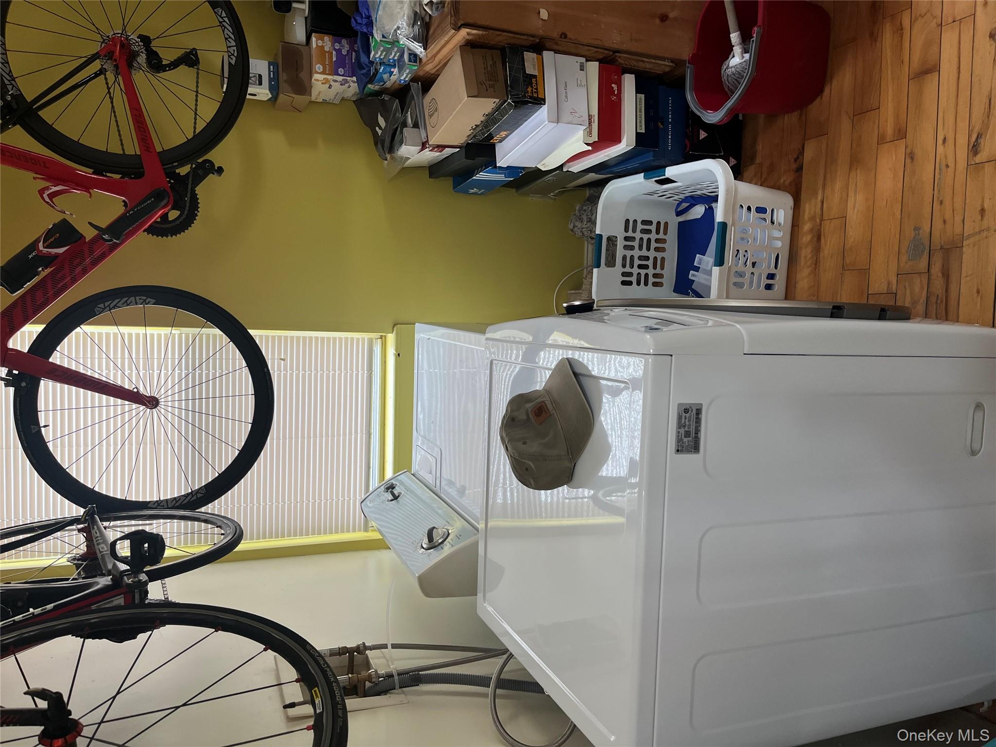 149 West Kingsbridge Road Mount Vernon, NY 10550 - Photo 9 of 25 Laundry area featuring light wood finished floors and separate washer and dryer