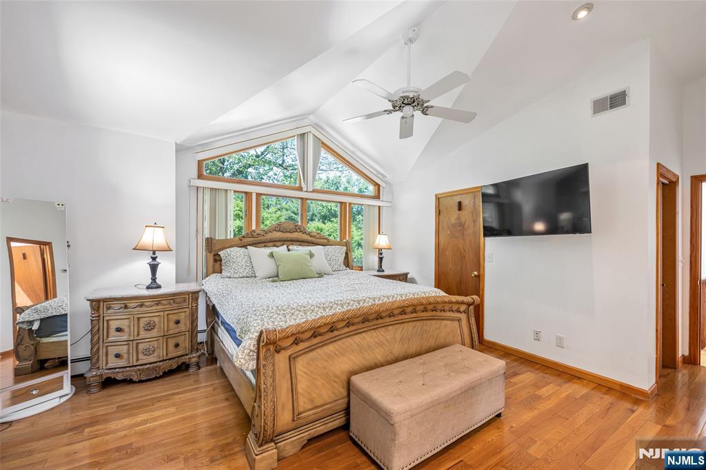21 Marcia Road Ringwood, NJ 07456 - Photo 16 of 42 a bedroom with a bed window and a flat screen tv