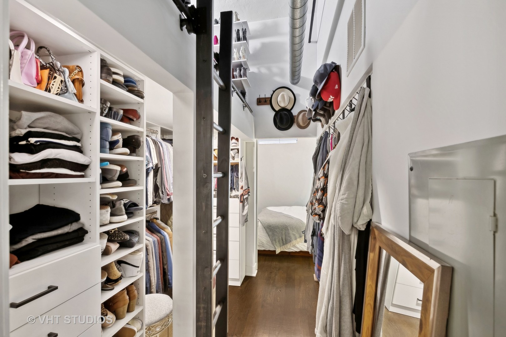 1000 West Washington Boulevard, Unit 319 Chicago, IL 60607 - Photo 12 of 15 a view of walk in closet with clothes and shoes