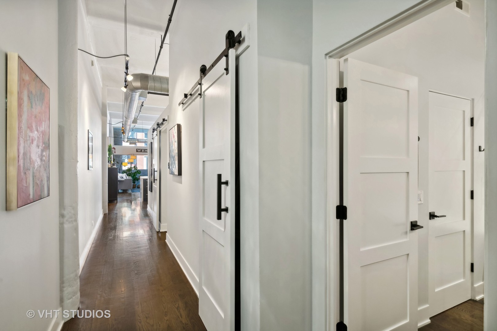 1000 West Washington Boulevard, Unit 319 Chicago, IL 60607 - Photo 13 of 15 a view of a hallway with a wooden floors