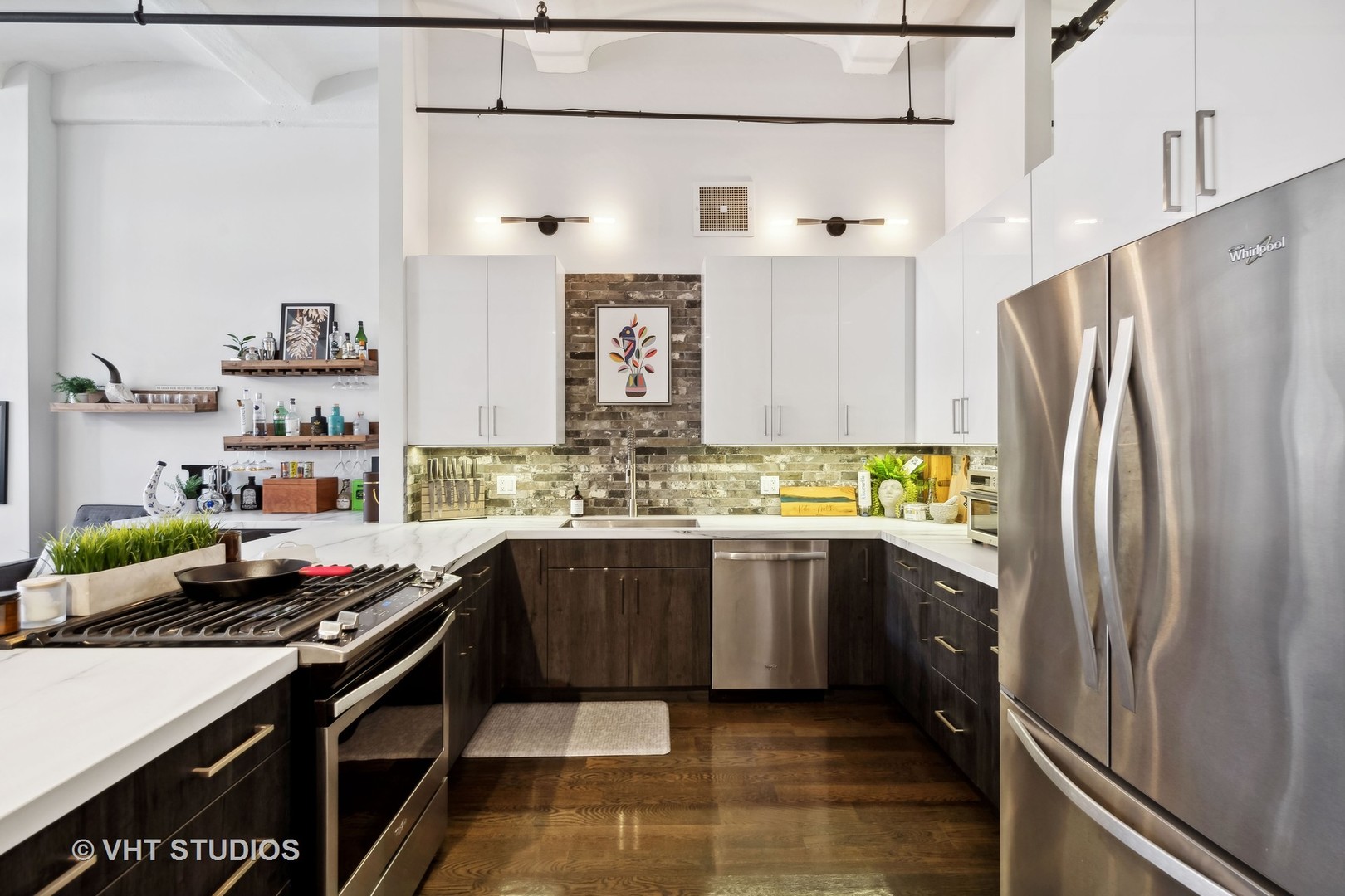 1000 West Washington Boulevard, Unit 319 Chicago, IL 60607 - Photo 7 of 15 a kitchen with stainless steel appliances granite countertop a sink stove and refrigerator