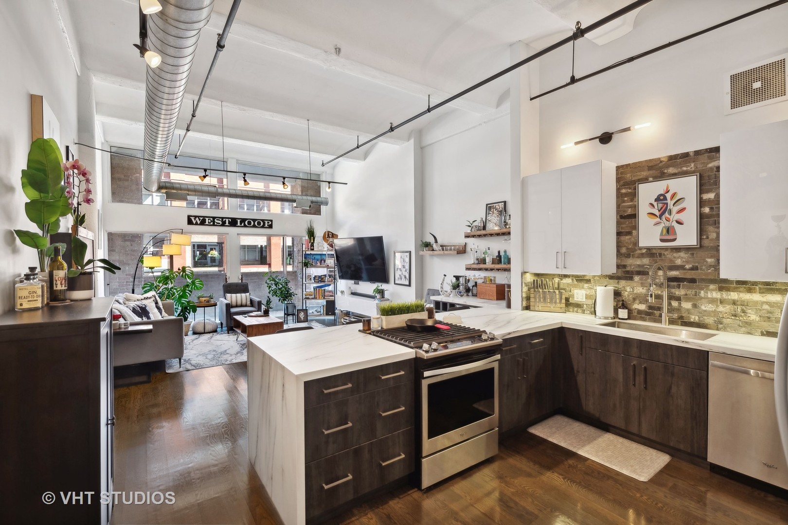 1000 West Washington Boulevard, Unit 319 Chicago, IL 60607 - Photo 8 of 15 a kitchen with a sink stove and cabinets