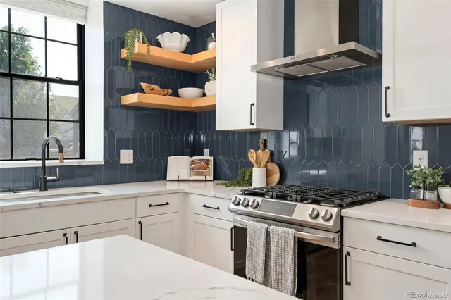 a kitchen with a stove and a sink