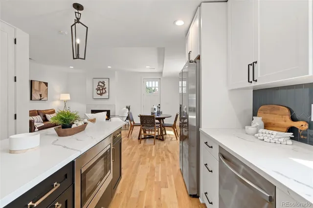 a kitchen with sink cabinets and dining table