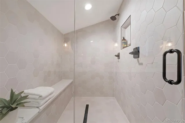 a bathroom with a shower and a shower