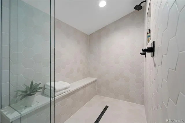 a bathroom with a bathtub and shower