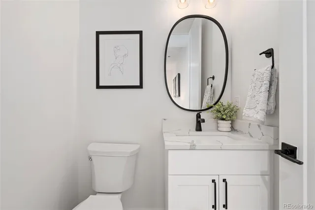 a bathroom with a toilet and a sink