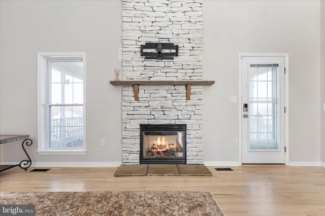 a bedroom with a bed and a fireplace