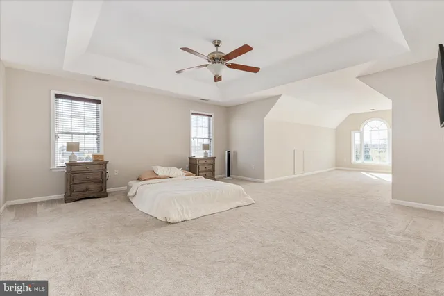 a bathroom with a bathtub a sink a vanity and a shower