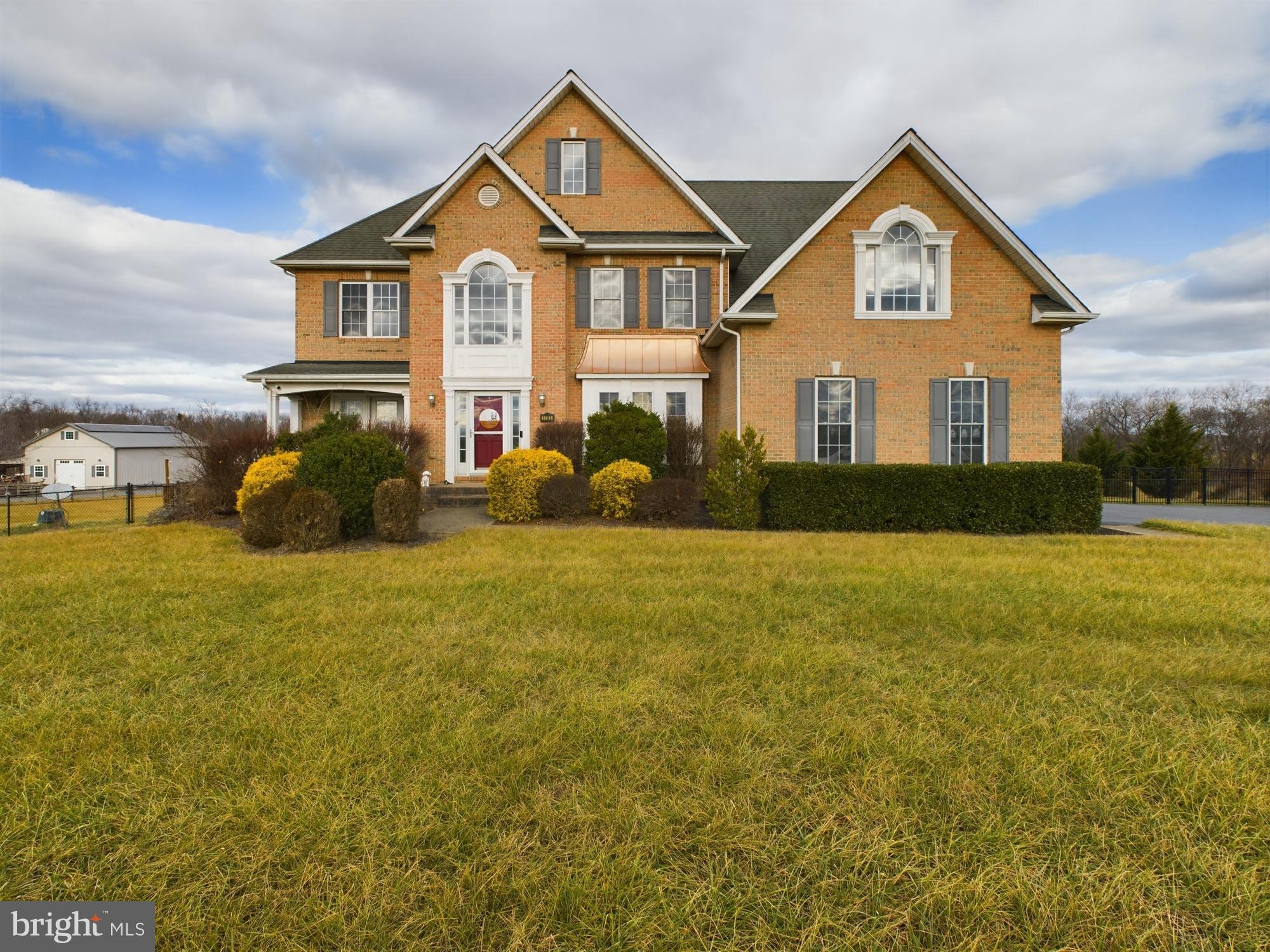 1781 Brucetown Road Clear Brook, VA 22624 - Photo 2 of 76 Elegant brick home with lush green lawn.