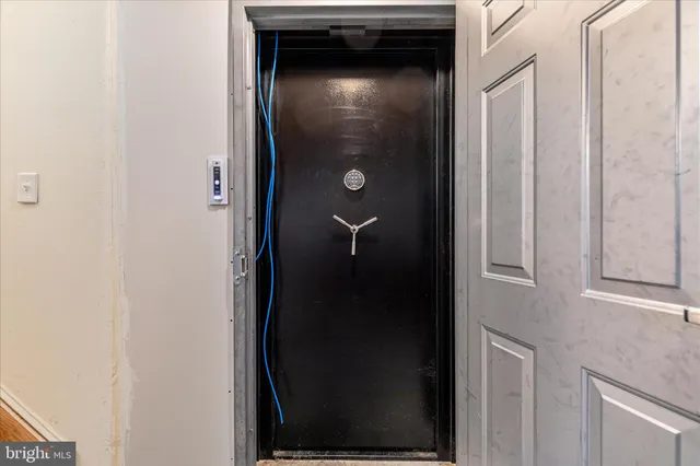 a view of swimming pool is in front of residential houses