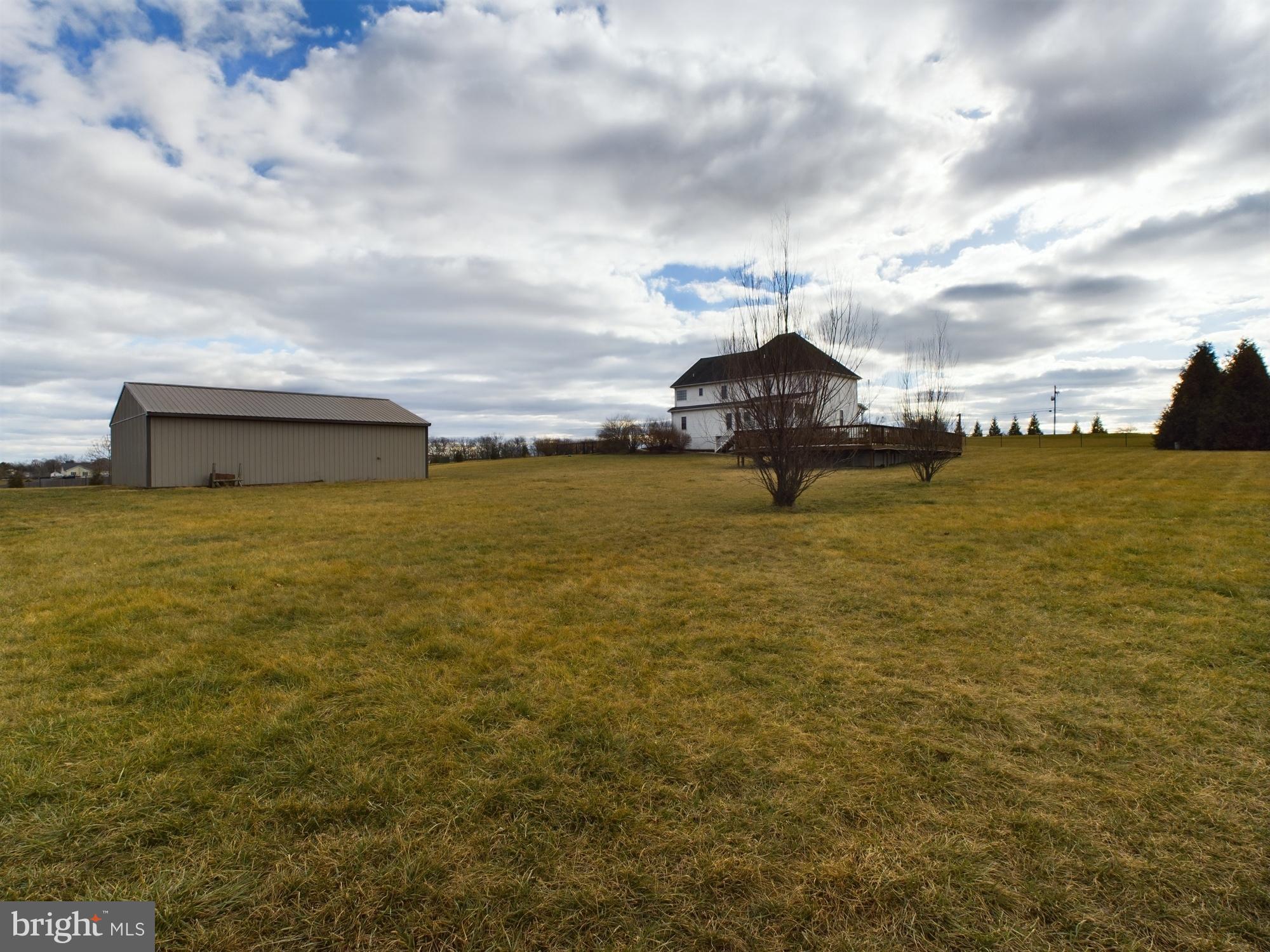 1781 Brucetown Road Clear Brook, VA 22624 - Photo 54 of 76 Spacious grounds beneath a dramatic sky.