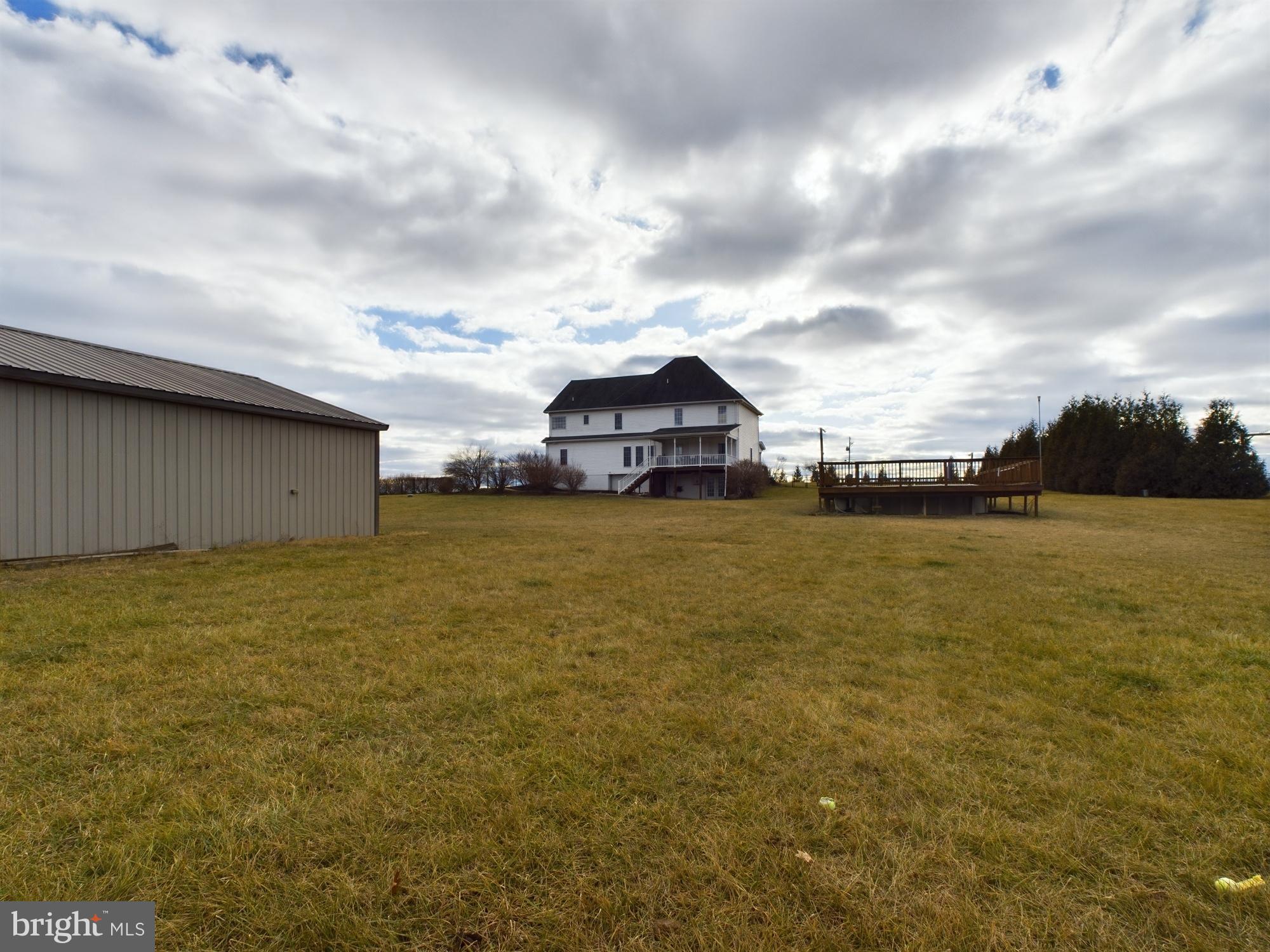 1781 Brucetown Road Clear Brook, VA 22624 - Photo 55 of 76 Spacious grounds beneath a dramatic sky.