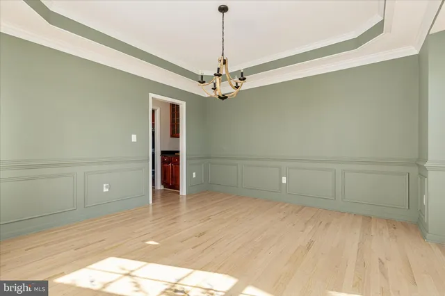 a view of an empty room with glass door