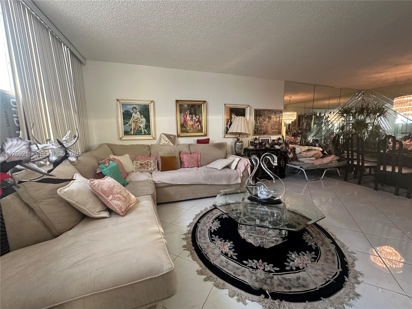 Oceanside Hallandale Beach, FL 33009 - Photo 21 of 54 a living room with furniture and a fireplace