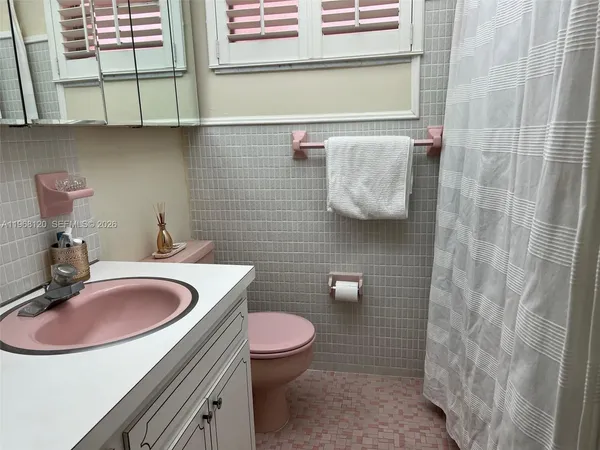 a kitchen with cabinets appliances and a sink