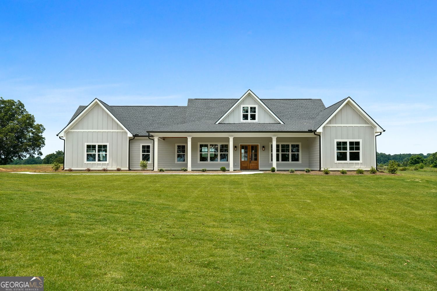 125 Sardis Church Road Barnesville, GA 30204 - Photo 1 of 1 a front view of a house with a garden