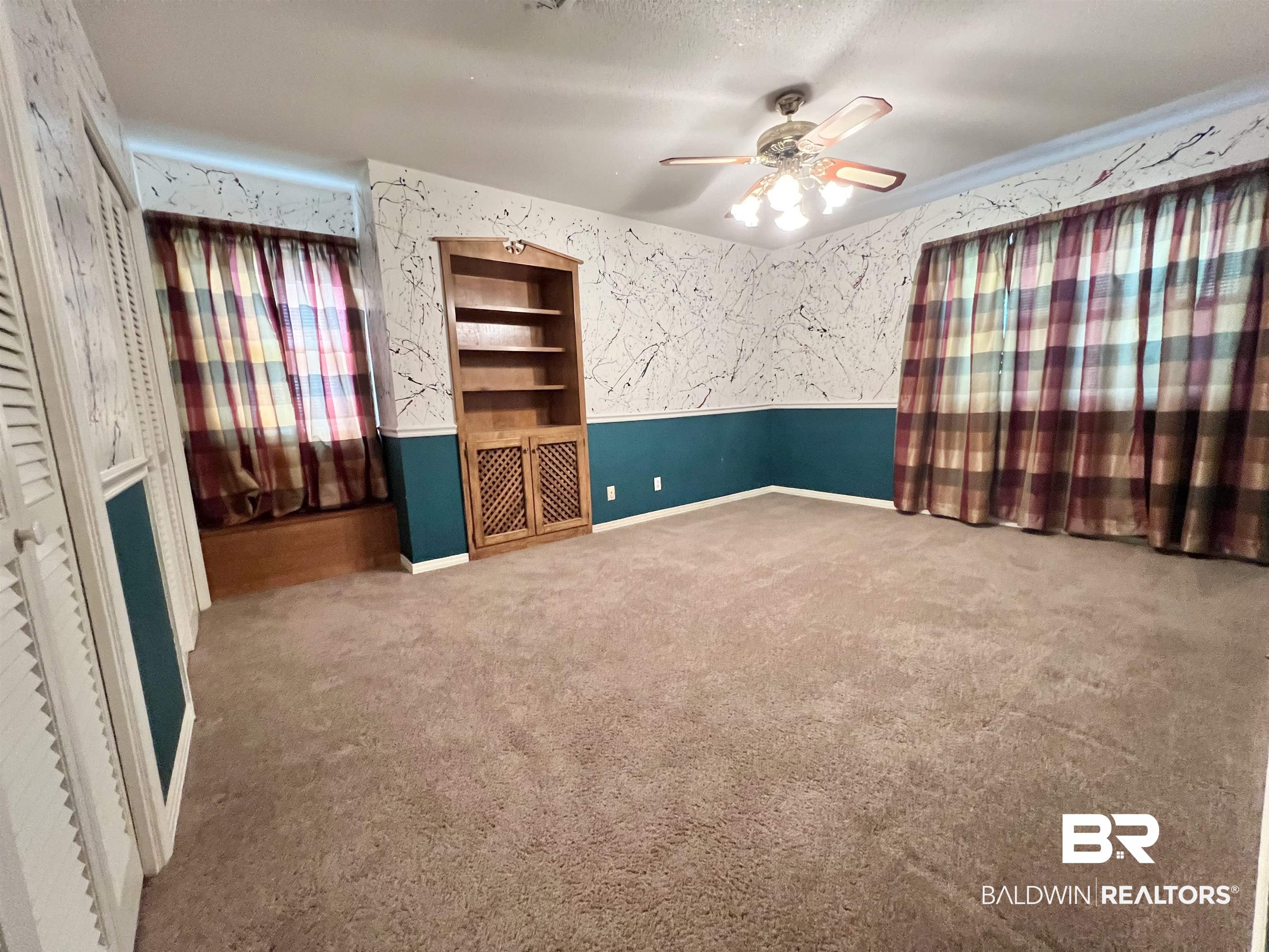 2691 Appleton Road Brewton, AL 36426 - Photo 39 of 60 Unfurnished room with carpet flooring, wallpapered walls, ceiling fan, and a textured ceiling