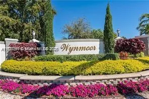 a view of a sign board with wooden fence