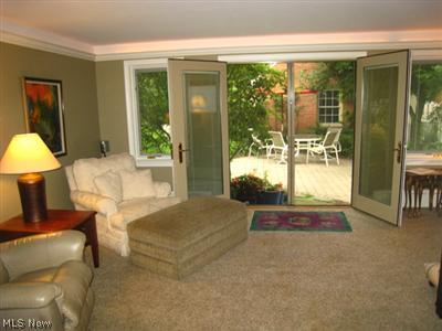 3342 Maynard Road Beachwood, OH 44122 - Photo 6 of 25 Wonderful 1st floor family room with plush carpeting and doors leading to the private rear yard and patio.