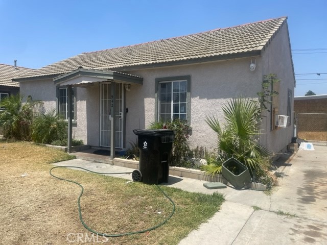 942 North Florence Avenue Colton, CA 92324 - Photo 1 of 13 a view of a house with potted plants
