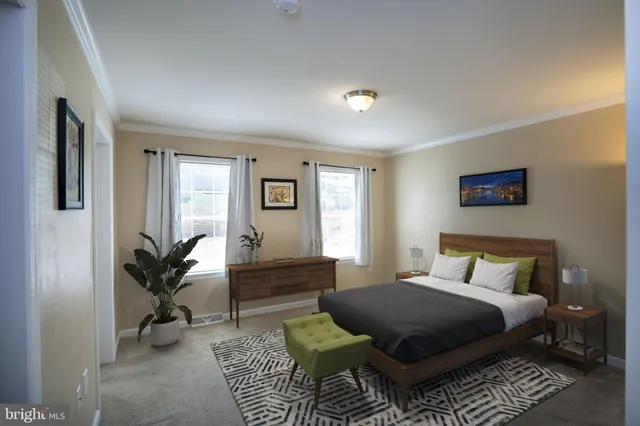 a bedroom with a bed outdoor view and a window